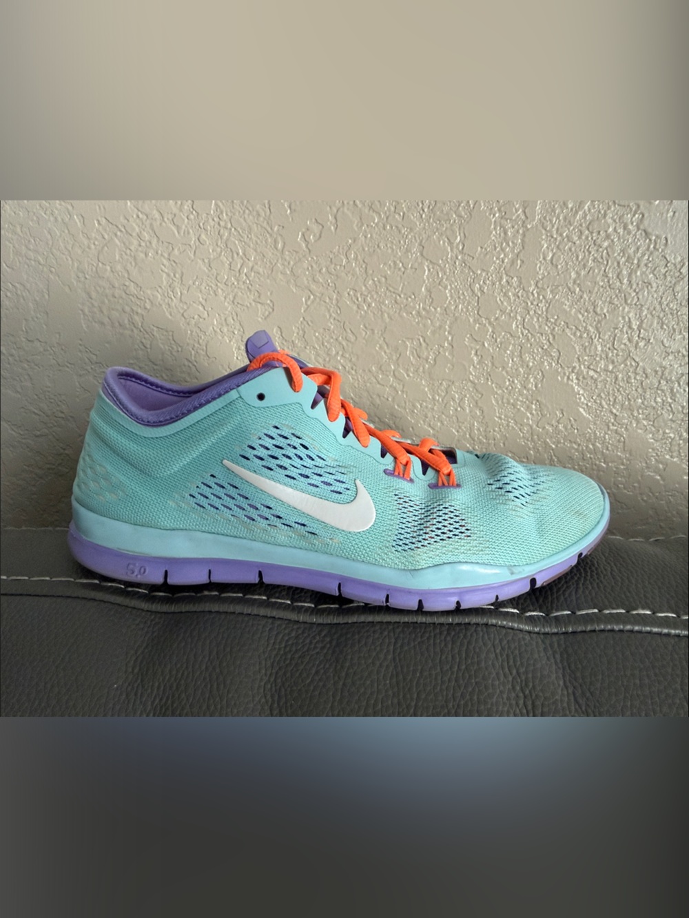Nike Women’s Turquoise Athletic Shoe with Purple Sole and Orange Laces